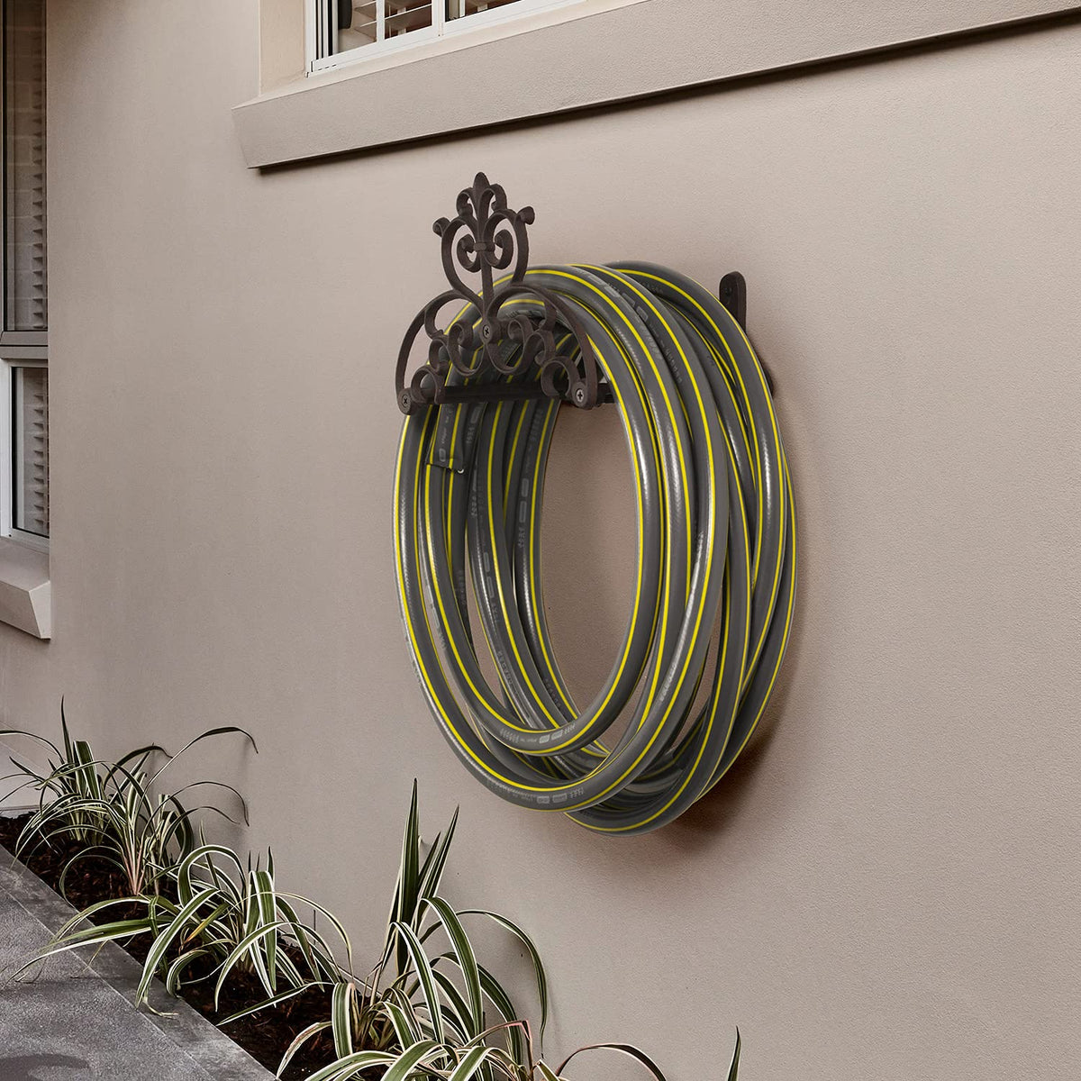 MyGift cast-iron hose hanger close-up scrollwork highlights vintage aesthetic and durable build.