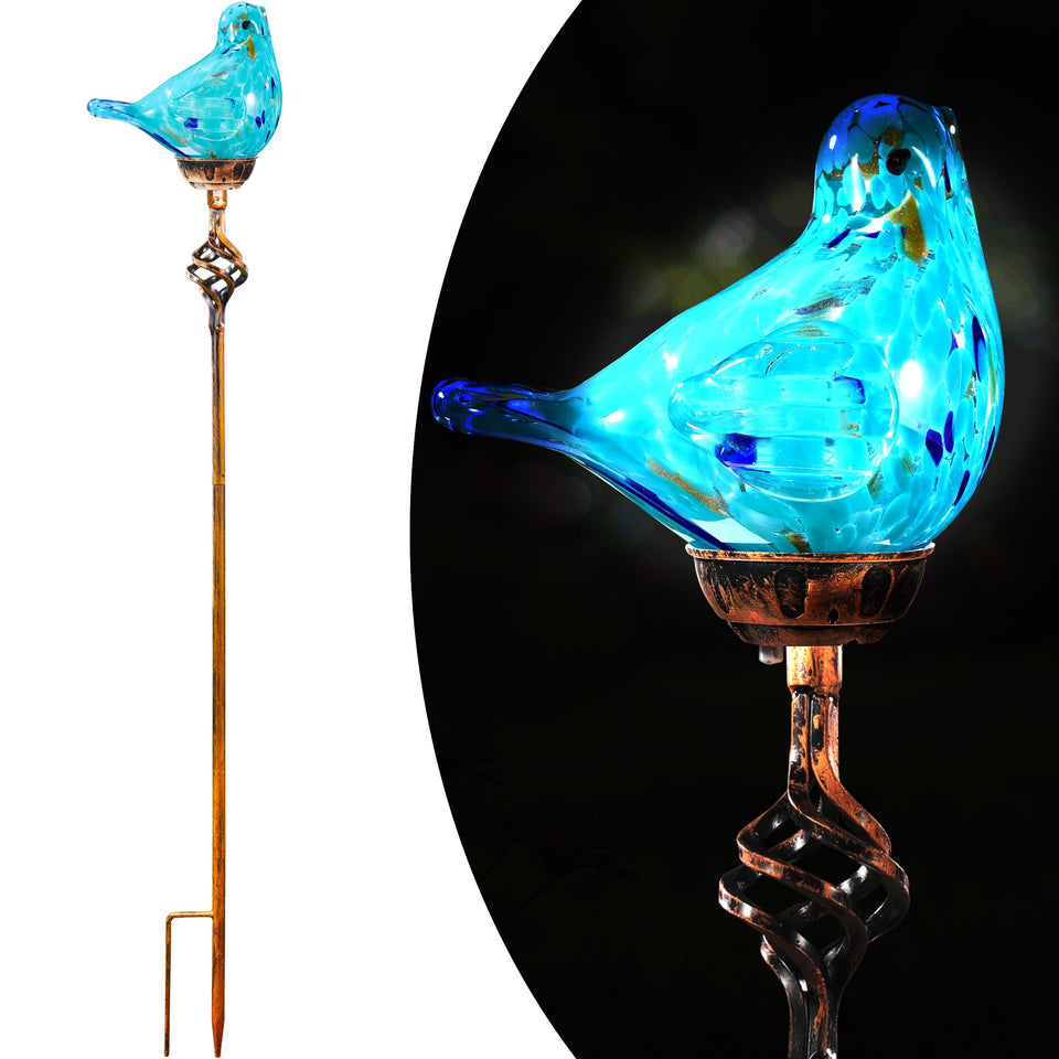 Naboher decorative solar bird stake light in soft blue glass illuminates pathways at dusk