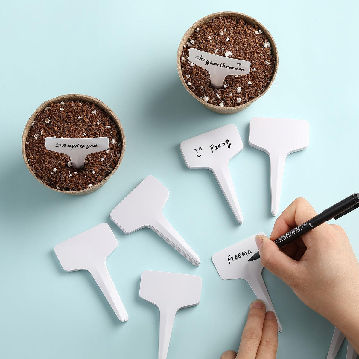NadaKin plastic seedling tags in soil, easy to insert and reuse