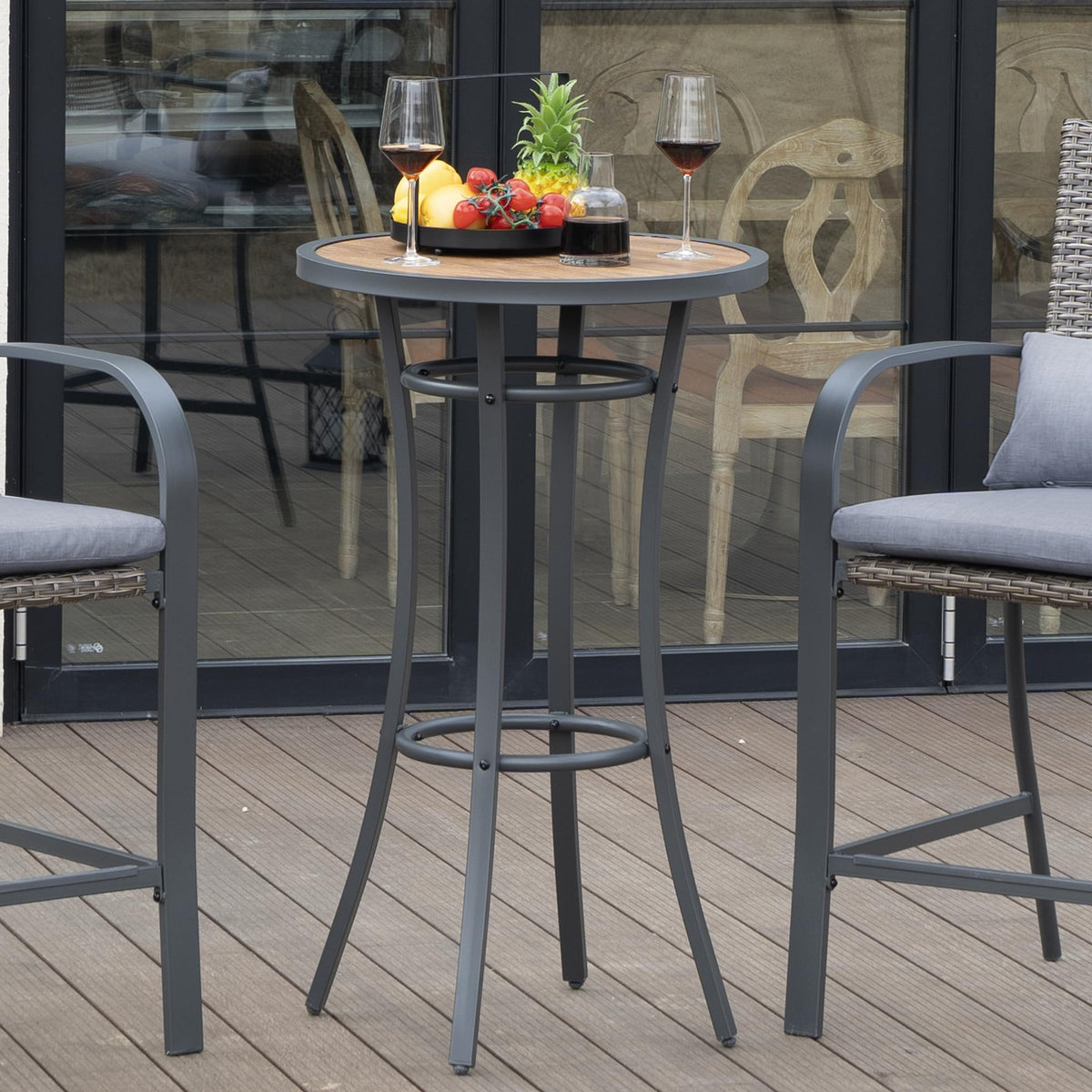Naga Bahna outdoor dining table in use on patio with seating
