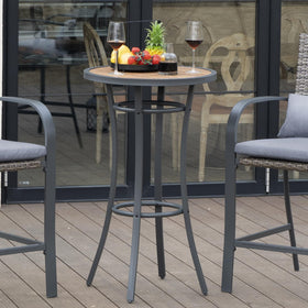 Naga Bahna outdoor dining table in use on patio with seating