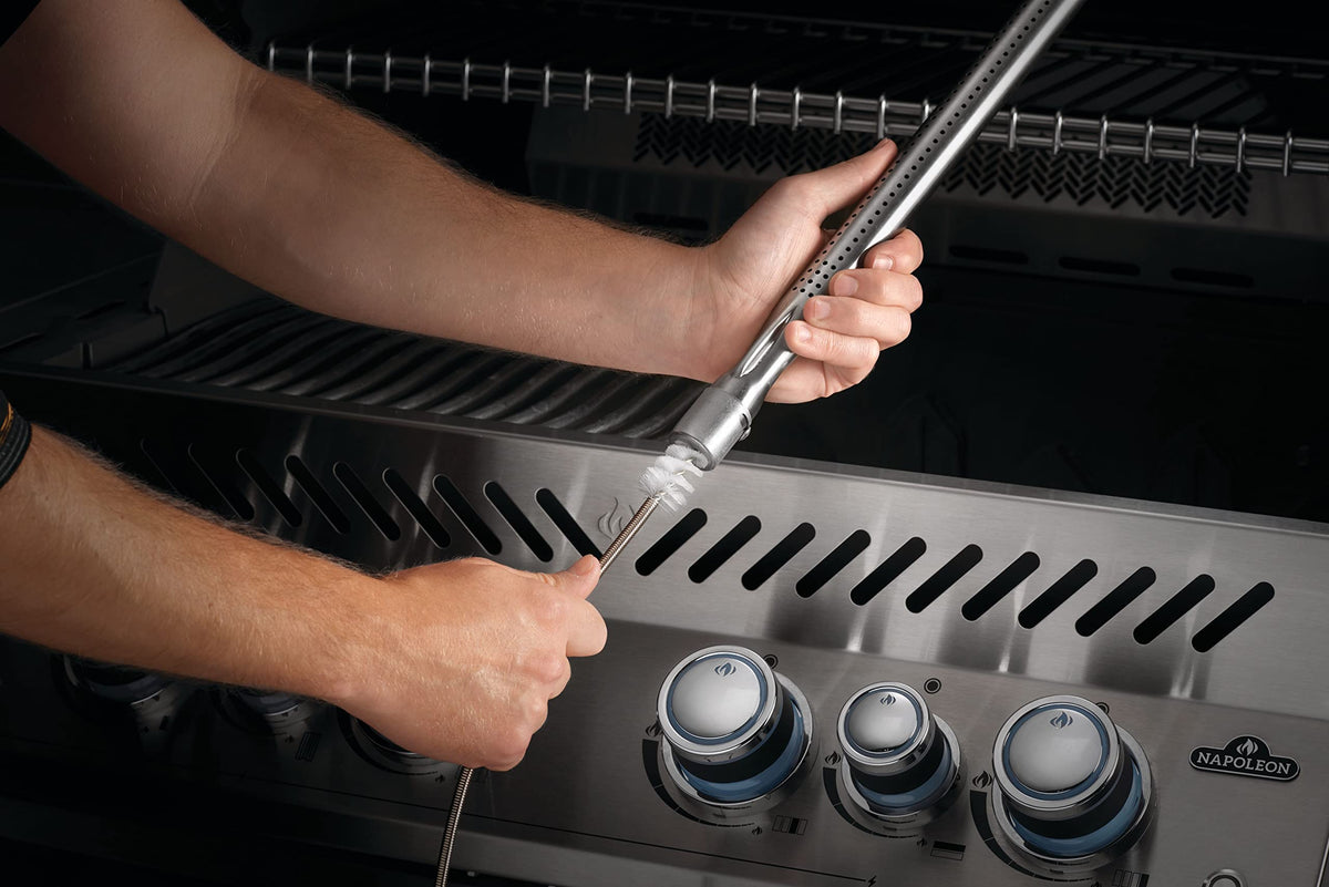 Napoleon gas grill cleaning toolset port hole cleaner slides out for quick access to burners