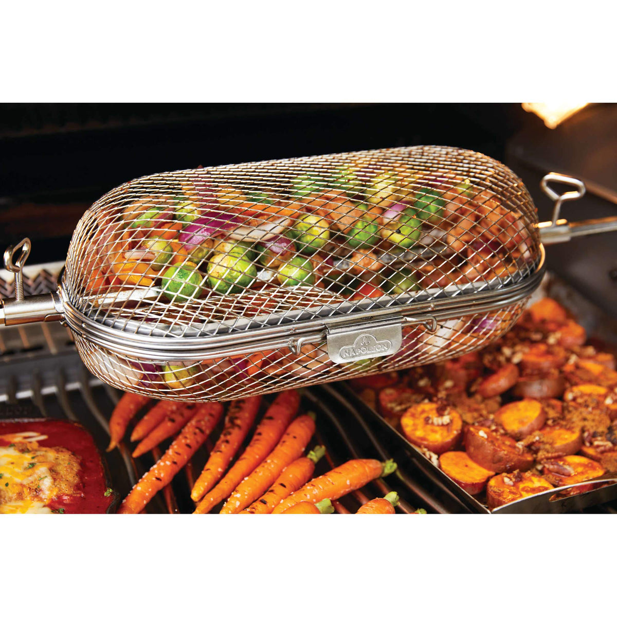 Napoleon rotisserie basket on a rear burner setup for grilled meals