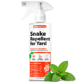 NatureStop snake repellent spray bottle on lawn edge deterring snakes near garden borders