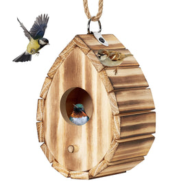 Natureylwl hummingbird house outdoors withstands wind and rain for steady use.