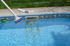 NEOHATION pool scraper loosening thick deposits for easier scrubbing