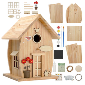 NESTO wooden bird house kit during assembly, a hands-on outdoor project for adults.
