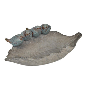 Newman House Studio bird feeder on a leaf adds garden charm and invites birds