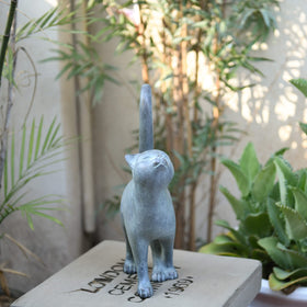 Newman House Studio kitten back view complements patio decor with antique bronze tone.