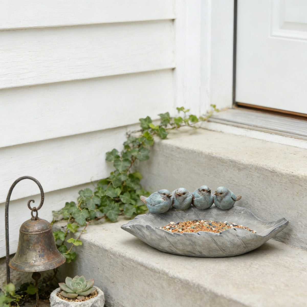 Newman House Studio polyresin bird figures with leaf motif