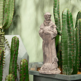 Newman House Studio Saint Francis statue, serene presence in garden spaces.