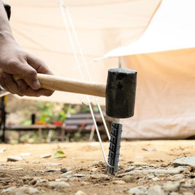 NHZ easy-installation chisel point penetrates hard soil with a hammer.