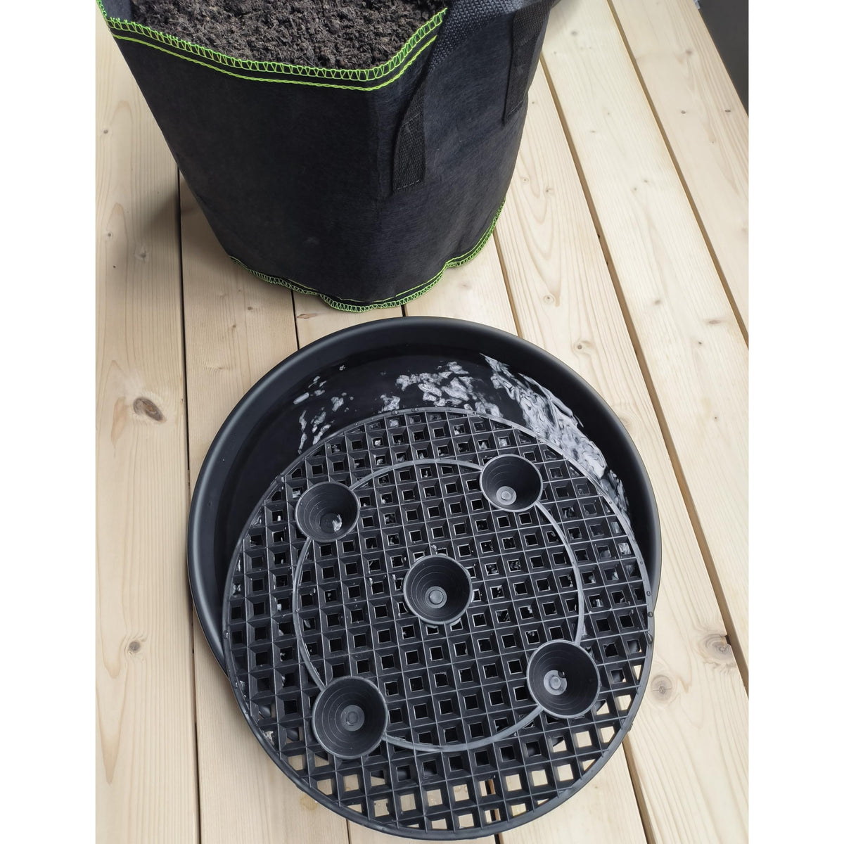 NIMYAU elevated plant stand keeps pots off the ground, supporting healthy growth.