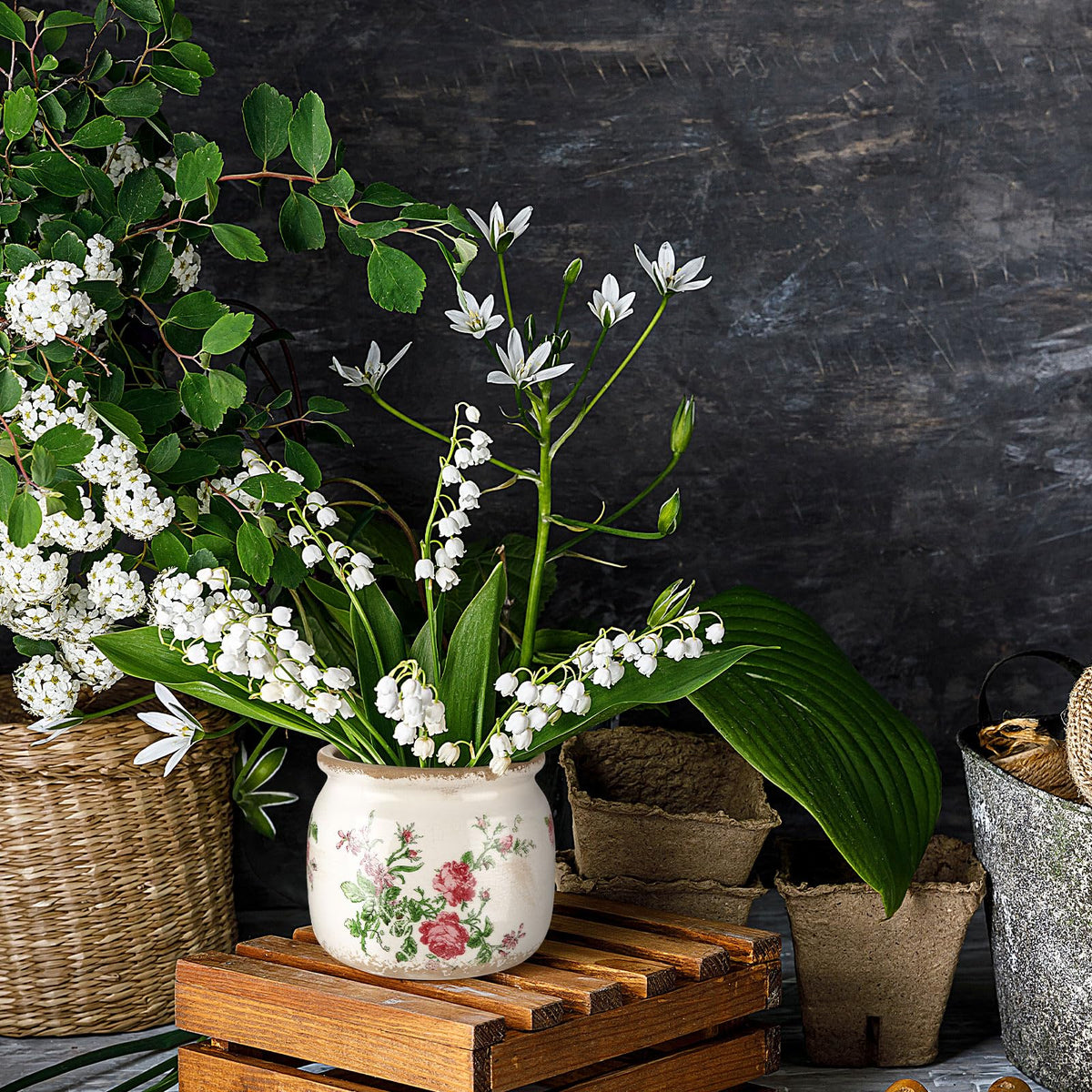 Ninehaoou floral arrangement planter works with faux or live greenery.