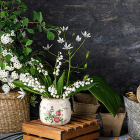 Ninehaoou floral arrangement planter works with faux or live greenery.