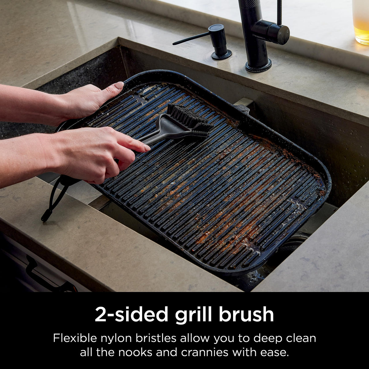 Ninja Woodfire Outdoor Grill Cleaning Brush with heat-resistant handle for safe scrubbing