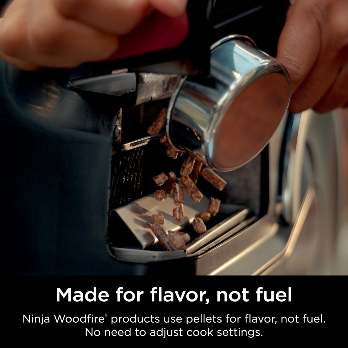 Ninja Woodfire smoke aroma rising from the grill with All Purpose Blend.