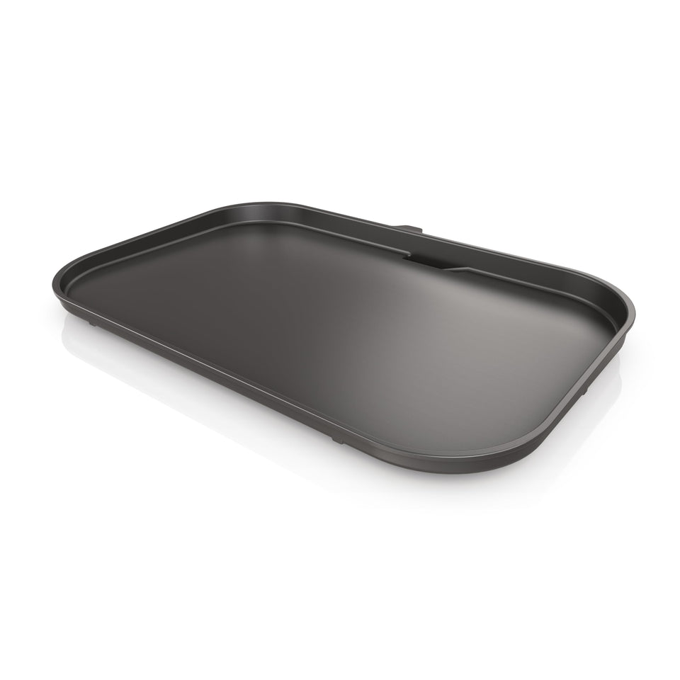 Ninja Woodfire Premium Griddle Plate demonstrating edge-to-edge heat for even searing.