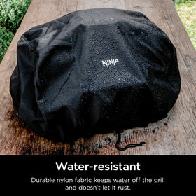 Ninja Woodfire Premium Outdoor Cover anti-fade fabric blocks sun without fading.