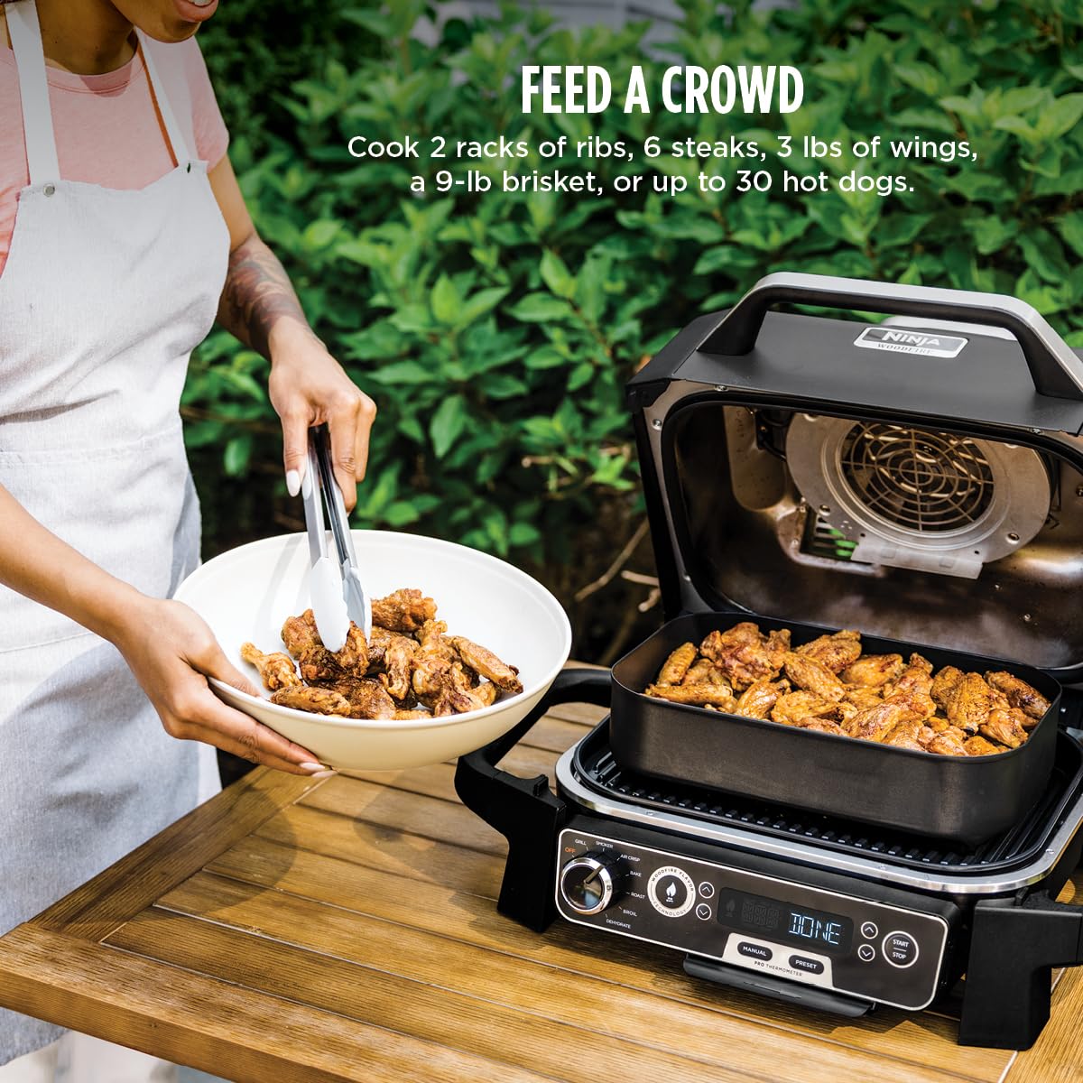 Ninja Woodfire Pro weather-resistant shell shown outdoors for year-round cooking