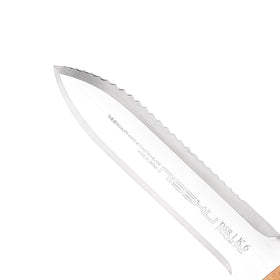 Nisaku NJP651 dual-edge blade close-up demonstrates beveled edge and serrated section.