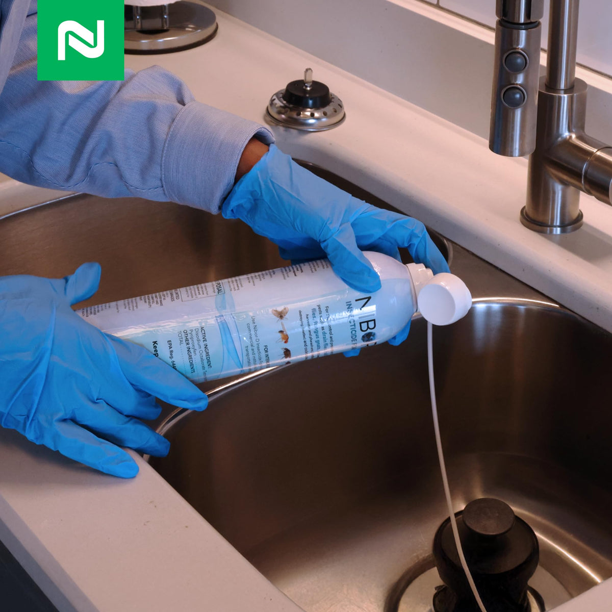 Nisus Nibor-D foam spraying action near a sink drain.