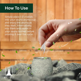 Dissolving crystals in warm water before pouring over sauna stones for aroma.