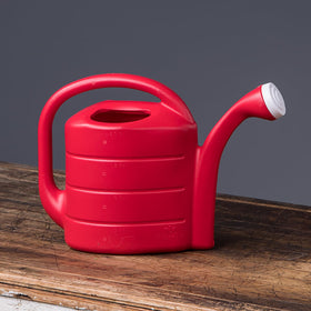 Novelty Root & Vessel 30411 red watering can close-up of measurement marks for accurate irrigation.