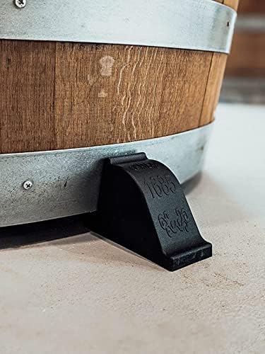 OAKENZ wine barrel feet lifting a planter to protect surfaces.
