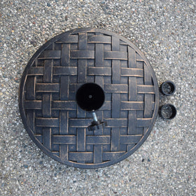 Oakland Living outdoor base in use with umbrella demonstrating secure tension screw
