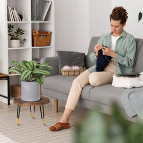 OBTAIN plant stand in mid-century style enhances room decor