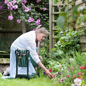 OfficeJOY portable garden stool pictured on patio, ideal for multi-task gardening.