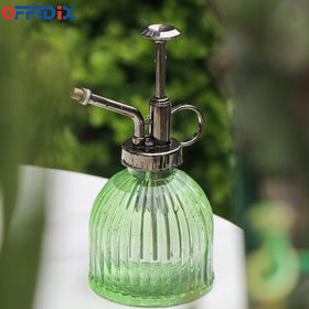 OFFIDIX mini watering bottle doubles as decor on plant stands.