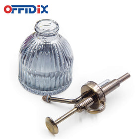 OFFIDIX Plant Mister glass body stands on a shelf for compact plant care.