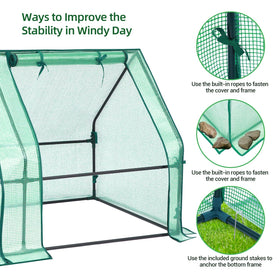 Ohuhu ground stakes stabilizing the lightweight greenhouse frame against wind.