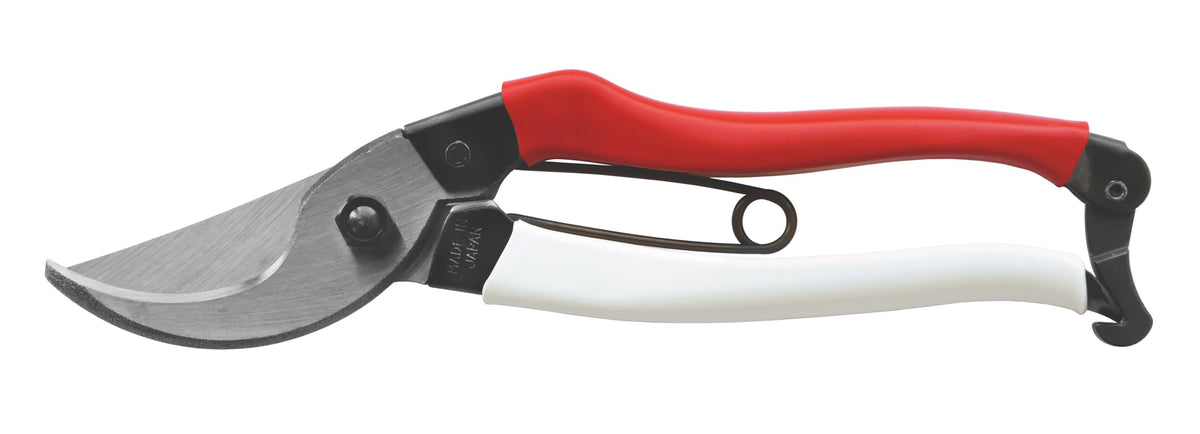 Okatsune pruning shears handle grip demonstrates comfortable control during pruning.