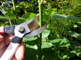 Okatsune pruning shears pattern-covering closeup highlights olefin wrap for grip and durability.
