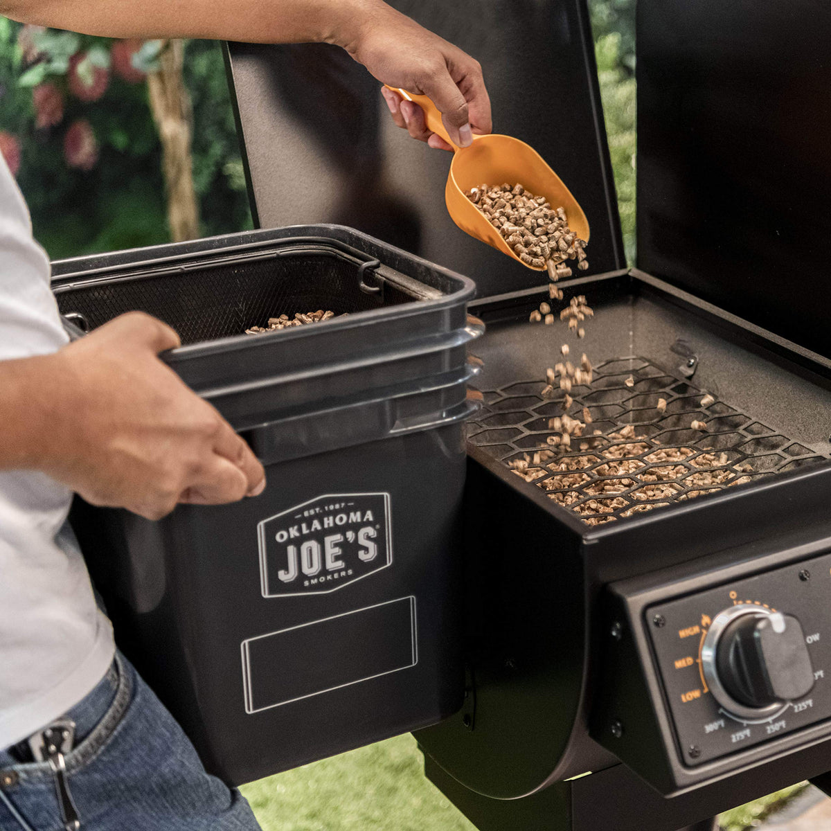 Oklahoma Joe's bucket filter demonstrates the wire-mesh design for cleaner burns.