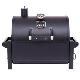 Oklahoma Joe's Rambler tabletop grill in compact setup for travel-ready cooking.