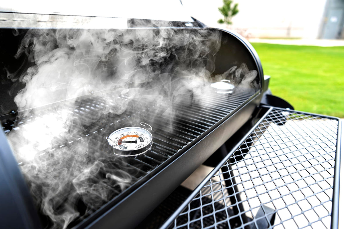 Gauges display marked temperature ranges for different cooking styles on large grates