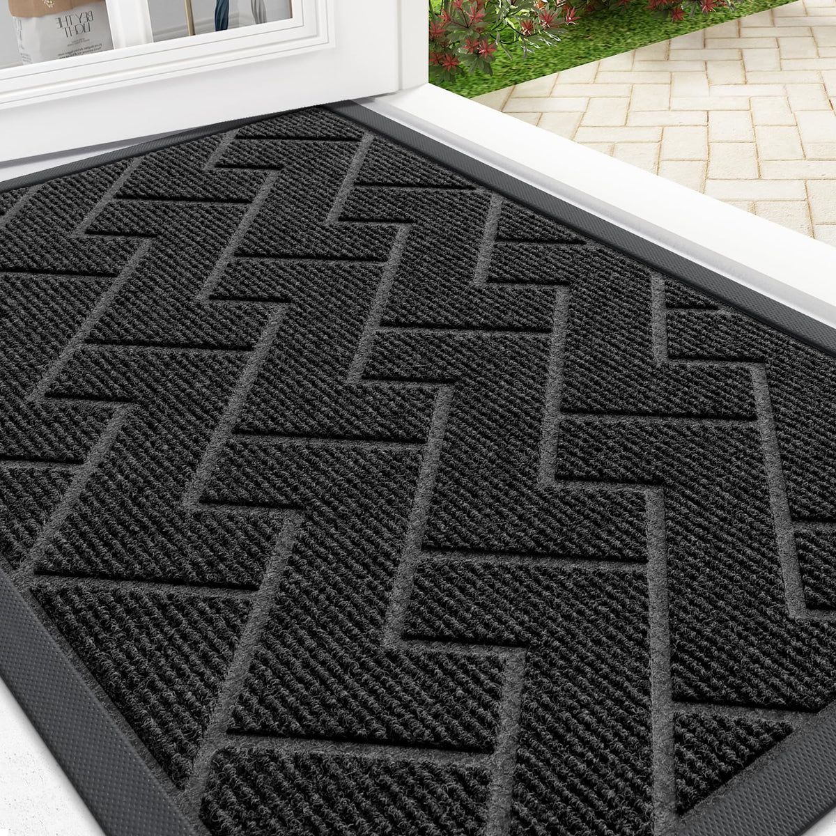 OLANLY front door mat in herringbone brick black with low-profile design for easy door passage and clean entryways.