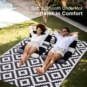 OLANLY soft-underfoot outdoor rug adds comfort on decks, porches, or yards.