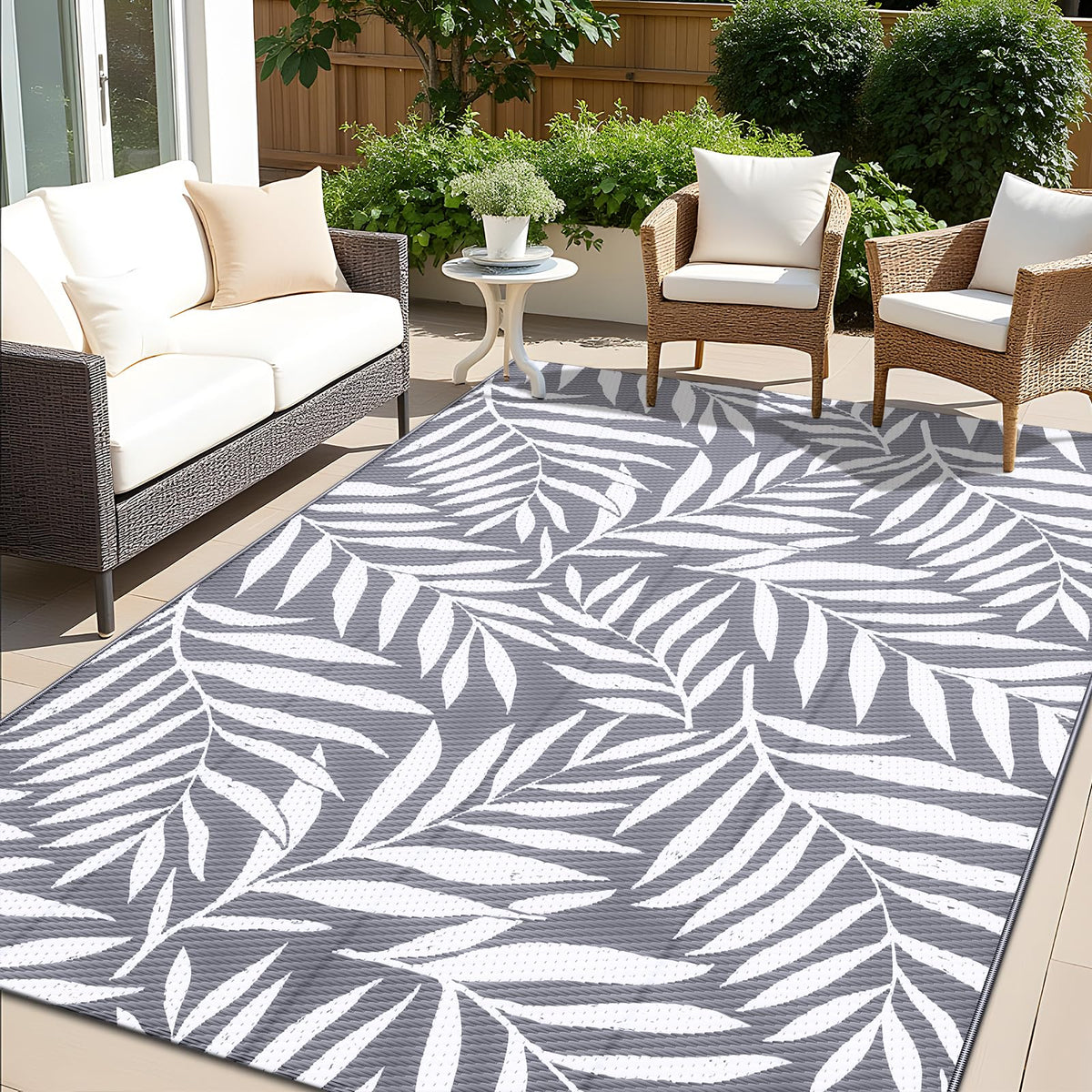 OLANLY waterproof outdoor rug with grey-white leaf pattern, durable for patios and decks.