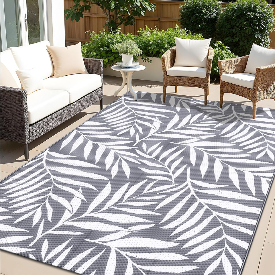 OLANLY waterproof outdoor rug with grey-white leaf pattern, durable for patios and decks.
