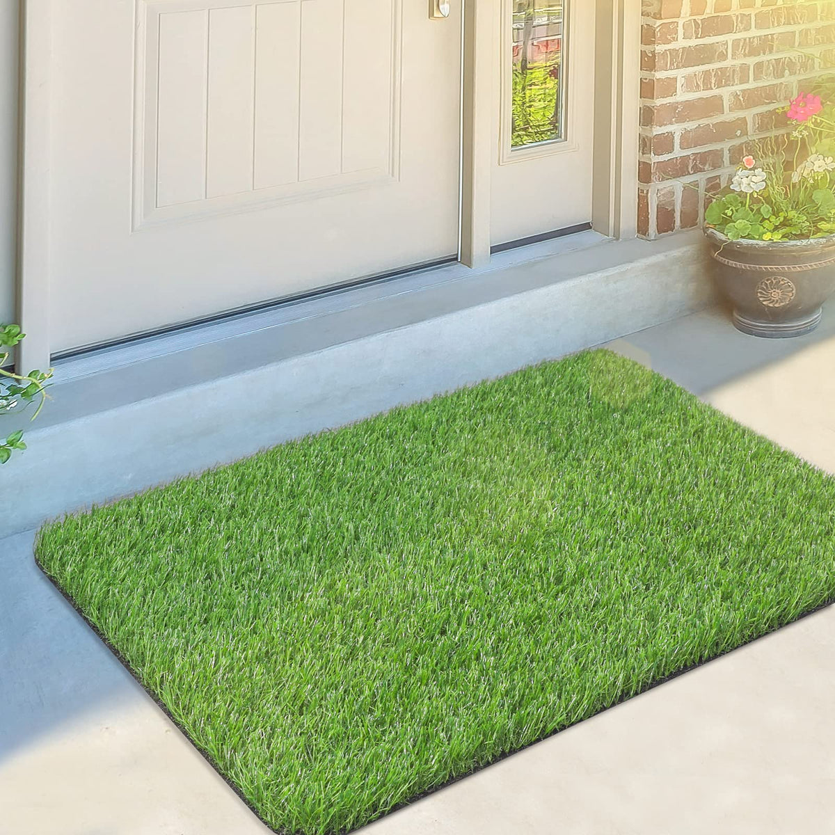 OLanto artificial grass door mat at the front entrance with non-slip bottom for safety