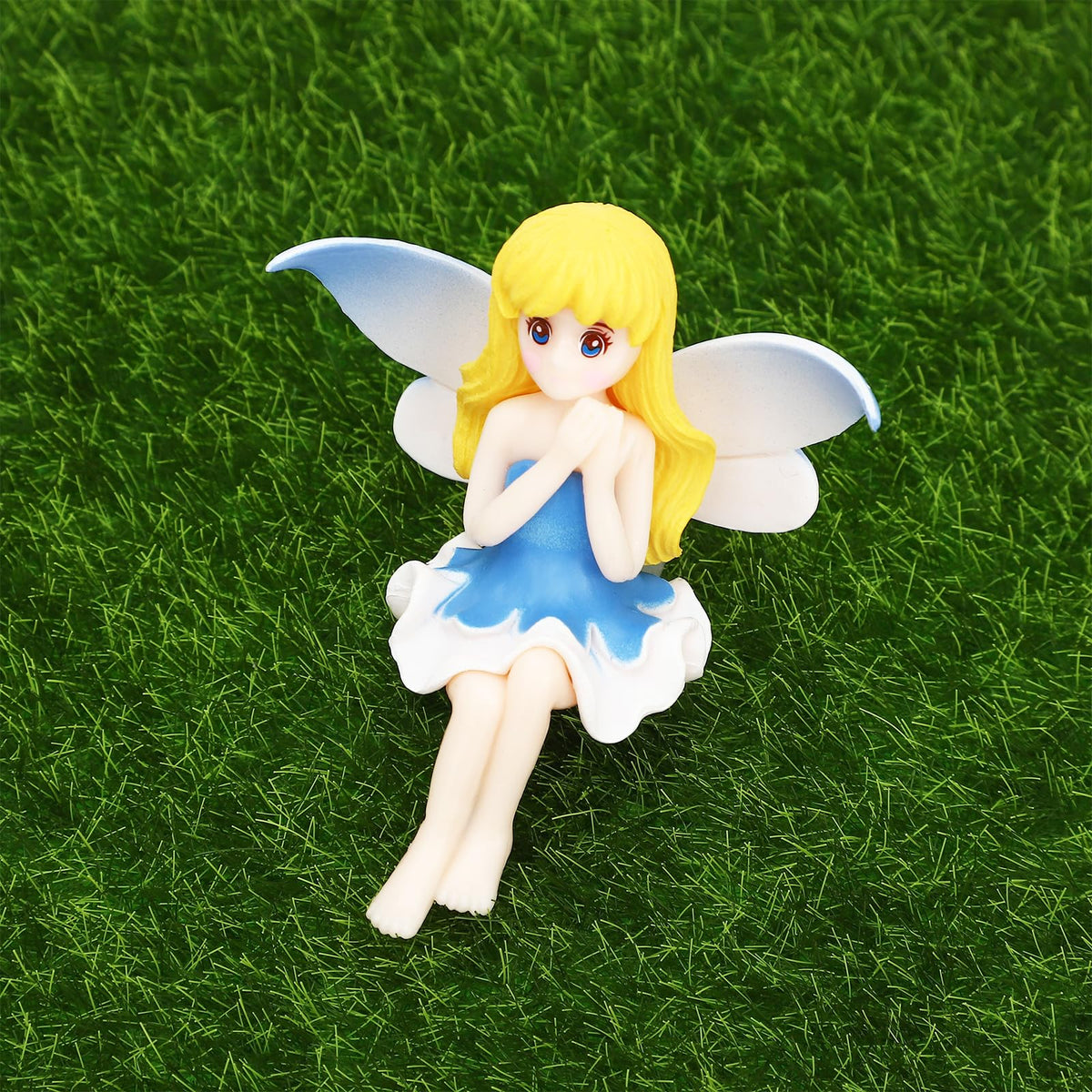 ONEST fairy garden figurine 05 smiles from tiny wings, great for gifts and prizes.