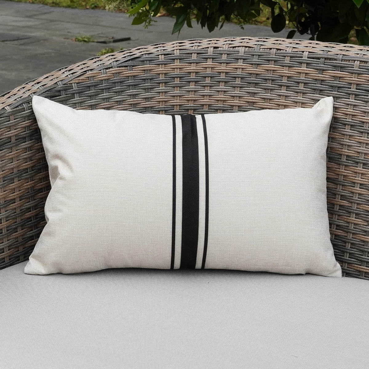 ONWAY striped pillow covers displayed on a patio sofa for chic backyard decor.