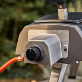 Back-attachment shown ready for fast gas-powered cooking outdoors.