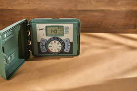 Orbit 4-Station Swing Panel Timer outdoor installation ready for weather resistance.