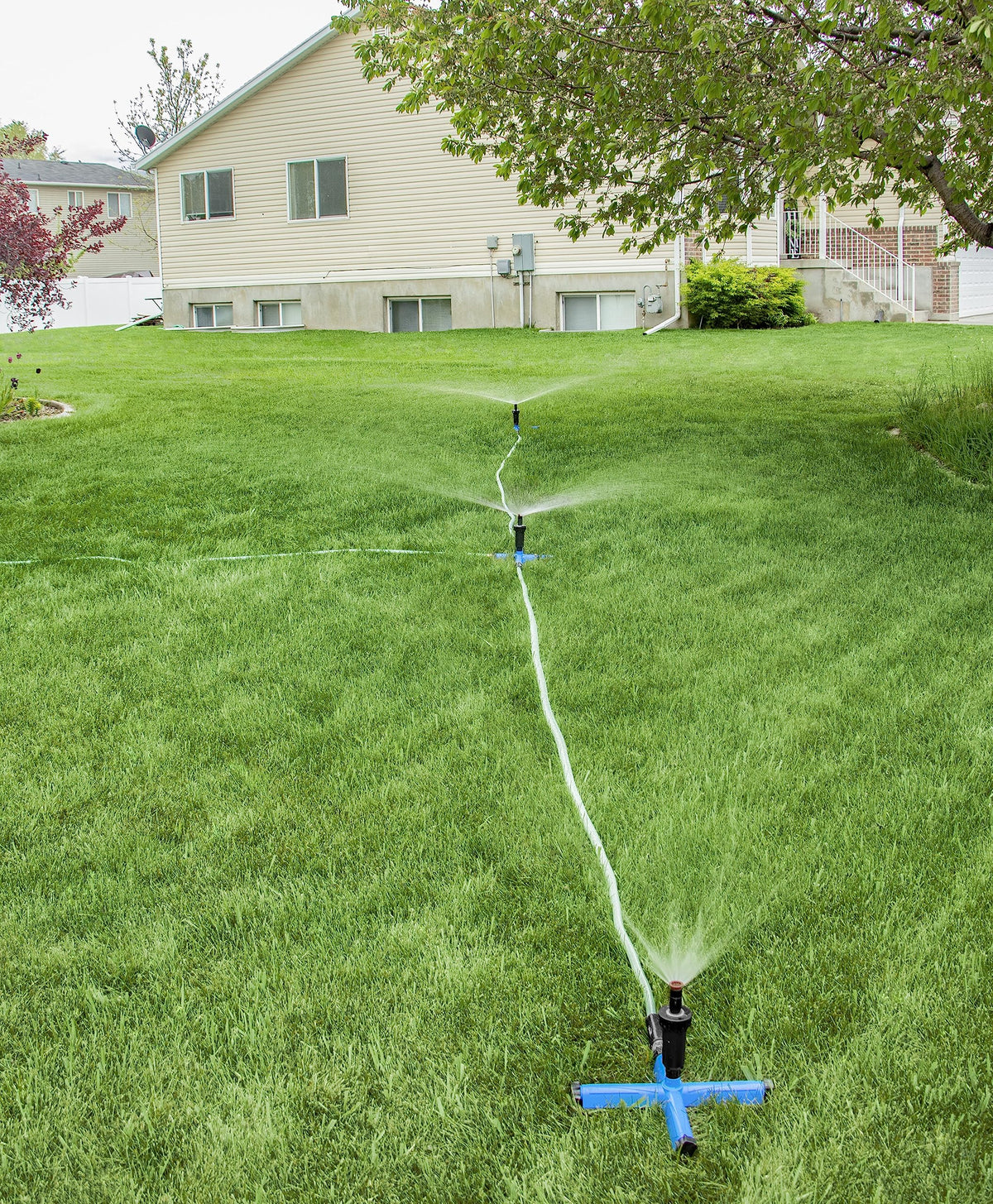 Orbit setup scene demonstrates portable irrigation ready for seasonal yard changes.